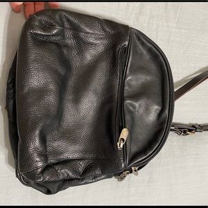 Black leather vintage sling style backpack purse